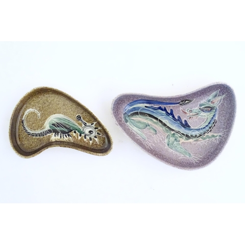 165 - Two studio pottery shaped dishes by Jo Lester, one with seahorse decoration, the other with dragon d... 