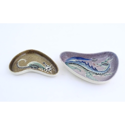 165 - Two studio pottery shaped dishes by Jo Lester, one with seahorse decoration, the other with dragon d... 