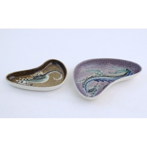 165 - Two studio pottery shaped dishes by Jo Lester, one with seahorse decoration, the other with dragon d... 