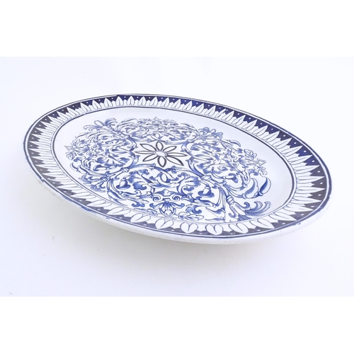 173 - A blue and white meat plate in the pattern Teutonic by Brown Westhead Moore. Marked under BWM & Co. ... 