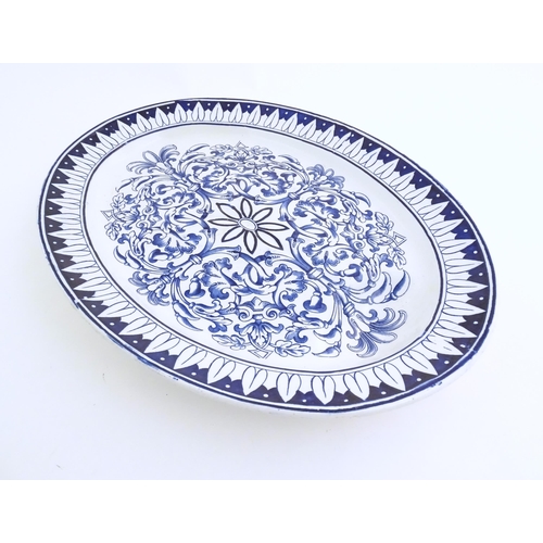 173 - A blue and white meat plate in the pattern Teutonic by Brown Westhead Moore. Marked under BWM & Co. ... 