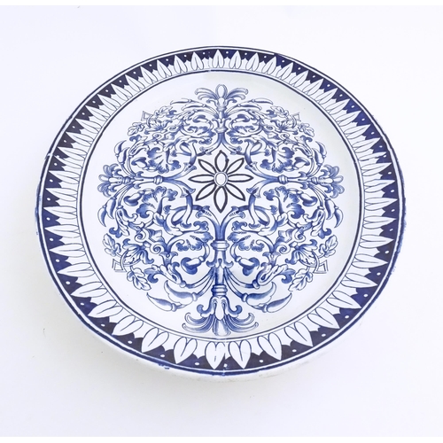 173 - A blue and white meat plate in the pattern Teutonic by Brown Westhead Moore. Marked under BWM & Co. ... 