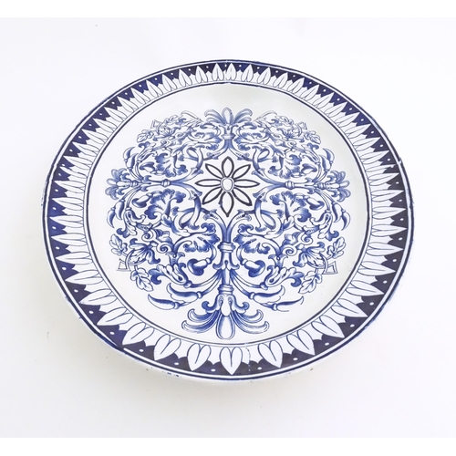 173 - A blue and white meat plate in the pattern Teutonic by Brown Westhead Moore. Marked under BWM & Co. ... 