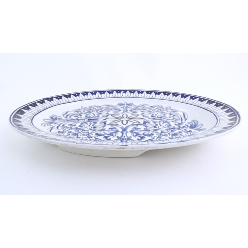 173 - A blue and white meat plate in the pattern Teutonic by Brown Westhead Moore. Marked under BWM & Co. ... 