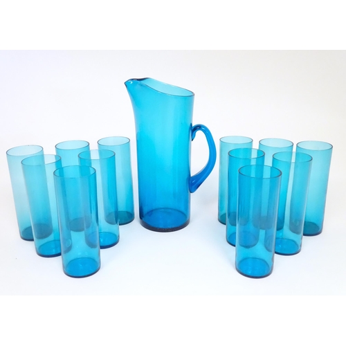 221 - A retro kingfisher turquoise blue coloured glass lemonade set comprising jug and 12 glasses. In the ... 