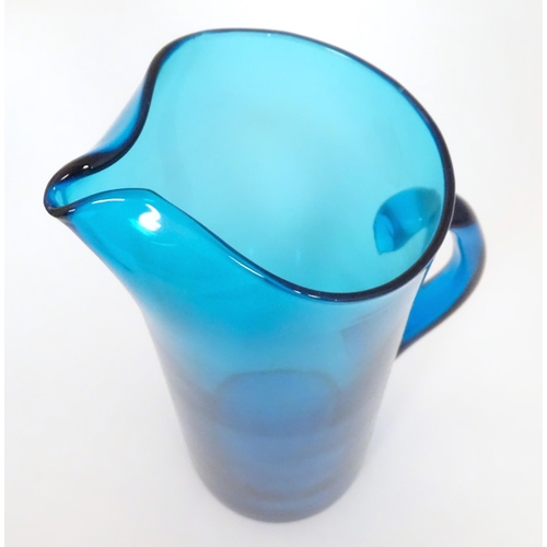 221 - A retro kingfisher turquoise blue coloured glass lemonade set comprising jug and 12 glasses. In the ... 