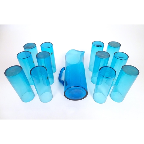 221 - A retro kingfisher turquoise blue coloured glass lemonade set comprising jug and 12 glasses. In the ... 