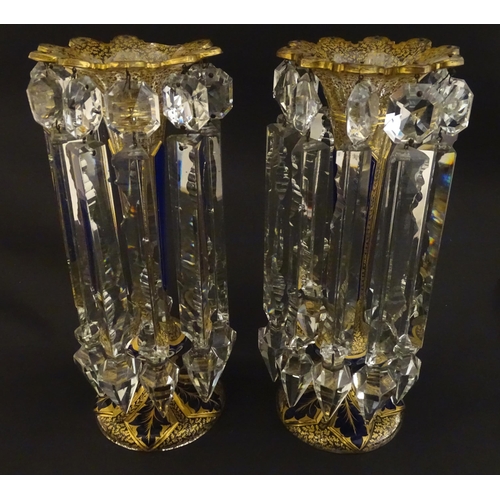 226 - A pair of Victorian glass table lustres with blue and gilt detail. Approx 12