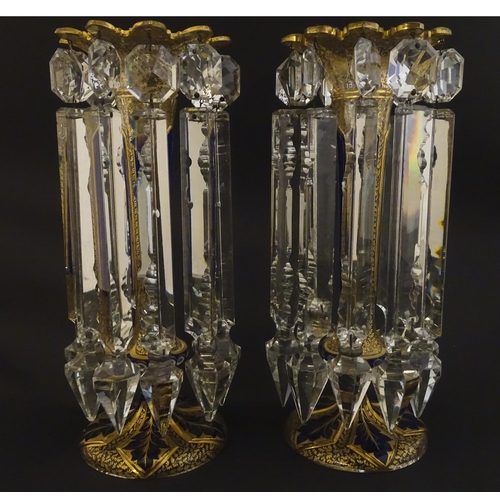 226 - A pair of Victorian glass table lustres with blue and gilt detail. Approx 12