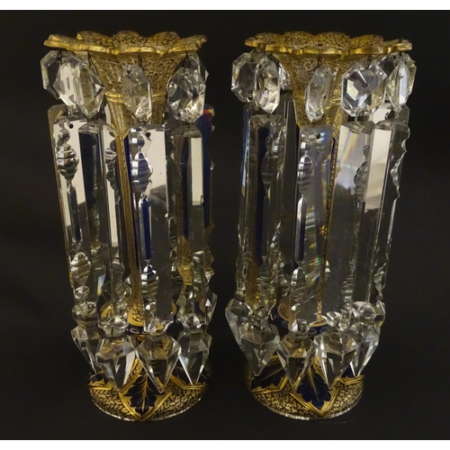 226 - A pair of Victorian glass table lustres with blue and gilt detail. Approx 12