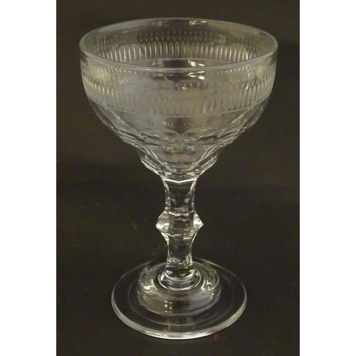 233 - A late 18thc sweetmeat  / champagne glass with facet cut detail. 6 1/4