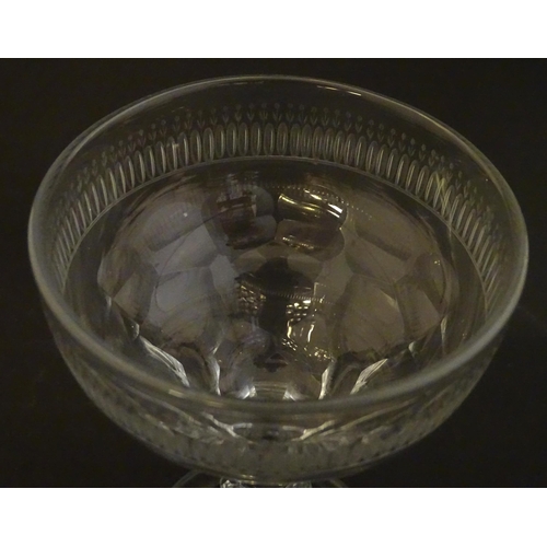 233 - A late 18thc sweetmeat  / champagne glass with facet cut detail. 6 1/4