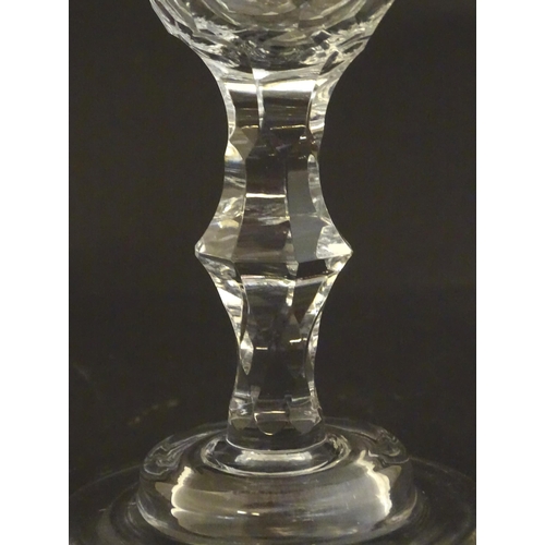 233 - A late 18thc sweetmeat  / champagne glass with facet cut detail. 6 1/4