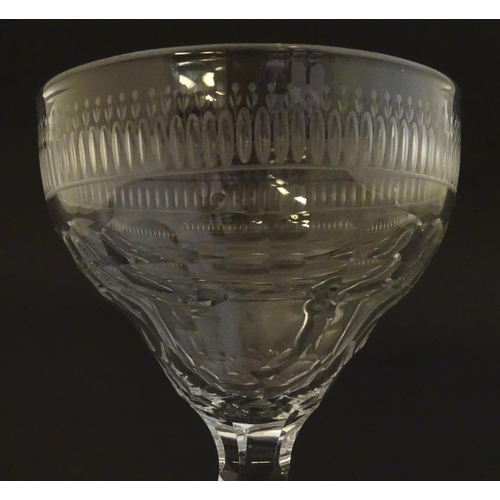 233 - A late 18thc sweetmeat  / champagne glass with facet cut detail. 6 1/4