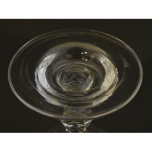 233 - A late 18thc sweetmeat  / champagne glass with facet cut detail. 6 1/4