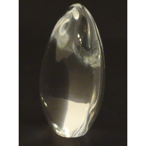 236 - Baccarat glass: a clear glass pebble shaped paperweight with Baccarat makers mark to base. Approx 3 ... 