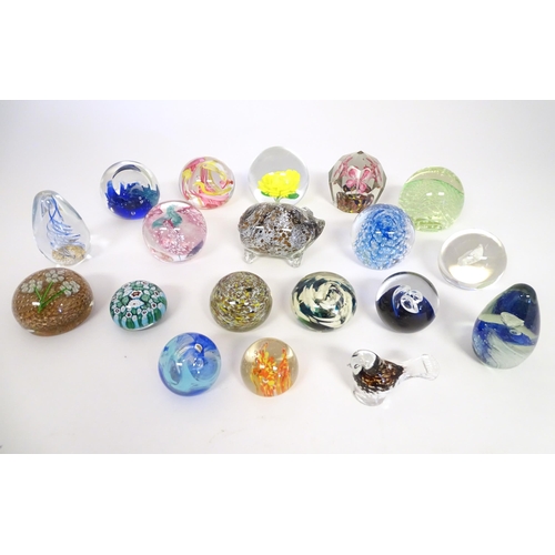 251 - A quantity of assorted glass paperweights, one formed as a pig, another a bird.  (19)