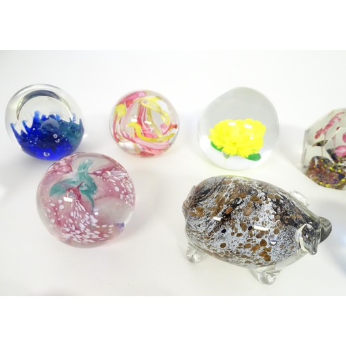 251 - A quantity of assorted glass paperweights, one formed as a pig, another a bird.  (19)