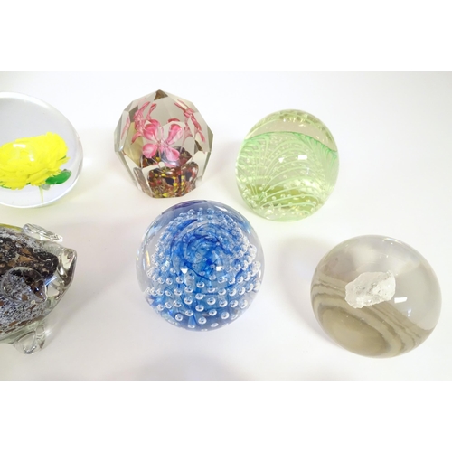 251 - A quantity of assorted glass paperweights, one formed as a pig, another a bird.  (19)