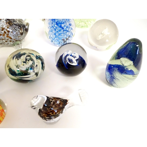 251 - A quantity of assorted glass paperweights, one formed as a pig, another a bird.  (19)