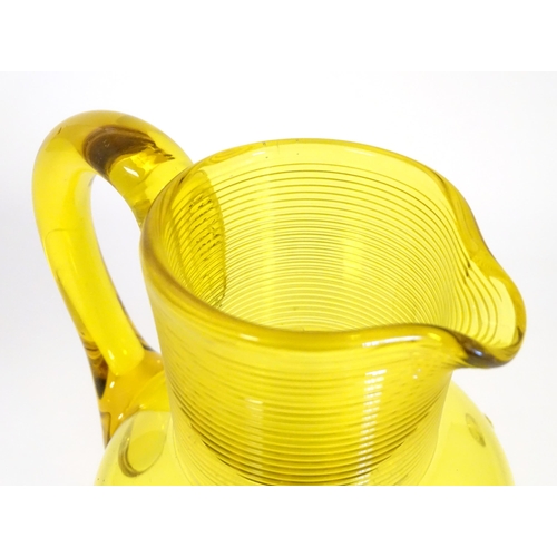 252 - A Victorian yellow glass jug with punt decoration. Approx 10 1/4