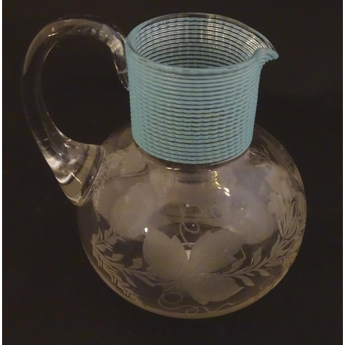 253 - A Victorian water jug with engraved floral and foliate decoration and turquoise banding. Approx. 5 1... 