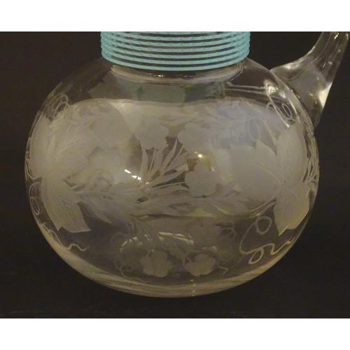 253 - A Victorian water jug with engraved floral and foliate decoration and turquoise banding. Approx. 5 1... 