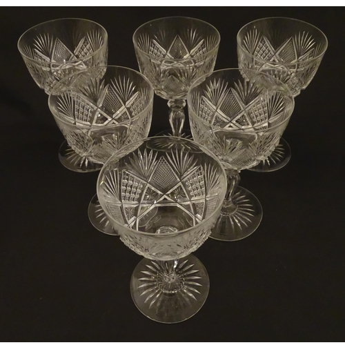 264 - Six 20thC pedestal wine glasses with cut decoration. Approx. 6