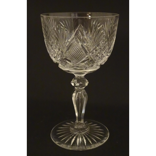 264 - Six 20thC pedestal wine glasses with cut decoration. Approx. 6