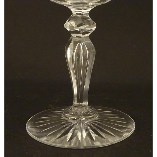 264 - Six 20thC pedestal wine glasses with cut decoration. Approx. 6