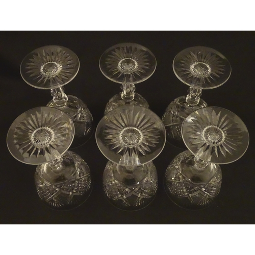 264 - Six 20thC pedestal wine glasses with cut decoration. Approx. 6