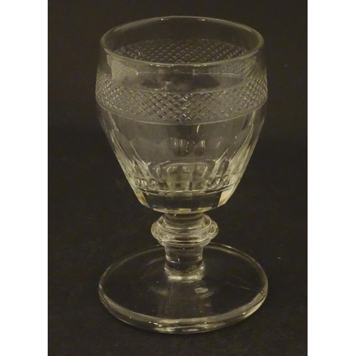 265 - A 19thC dram / liquor glass with facet cut detail 3 3/4