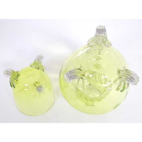 268 - A yellow glass water jug with clear glass handle and feet, together with a matching glass. The jug  ... 