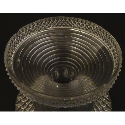 277 - A 19thC cut glass pineapple stand with wide flared foot cut with a hobnail band rising to a stepped ... 