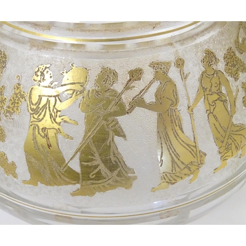 279 - An early 20thC glass decanter with banded gilt detail depicting classical figures. Probably by Moser... 