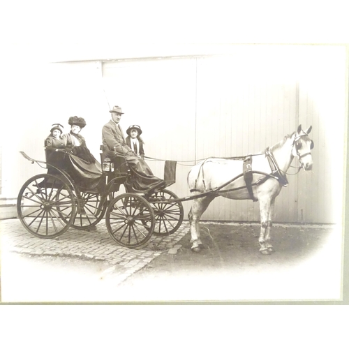 933 - A Victorian photograph depicting figures in a horse drawn carriage. The mount with photographer's st... 