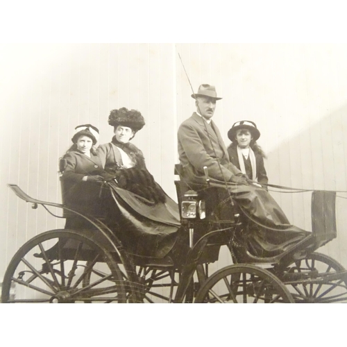 933 - A Victorian photograph depicting figures in a horse drawn carriage. The mount with photographer's st... 