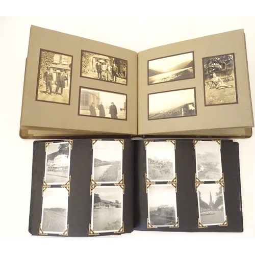 945 - Two early 20thC photograph albums to include portraits, group photos, motorbikes, cars, boats, bipla... 