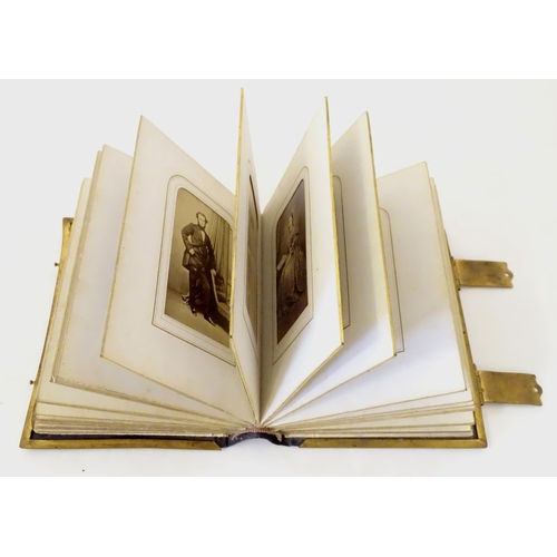 949 - A Victorian carte de visite photograph album containing various portrait cards and prints.