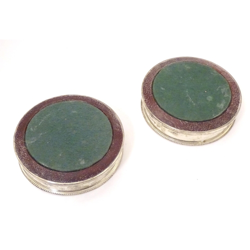 324 - A pair of silver coaster with turned wooden bases. Hallmarked London 1987 maker Payne & Son Approx 5... 