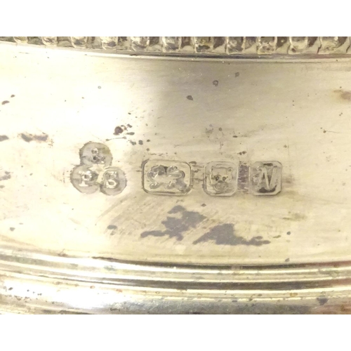 324 - A pair of silver coaster with turned wooden bases. Hallmarked London 1987 maker Payne & Son Approx 5... 