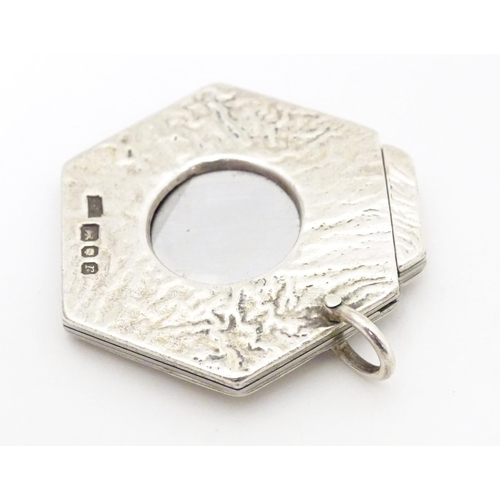 476A - A silver cigar cutter of hexagonal pendant form, hallmarked London 1972, maker Ramsdon and Roed. App... 