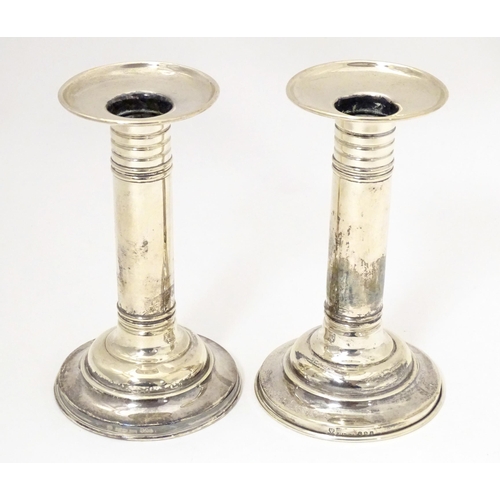 494 - A pair of American silver candlesticks, maker Meriden Britannia & Co. Approx. 5 3/4