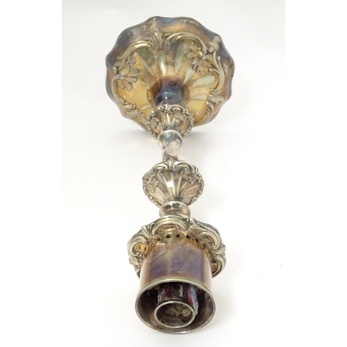 541 - A silver plate candlestick with acanthus scroll detail. Approx. 11 1/2