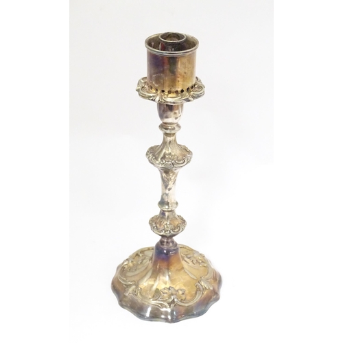 541 - A silver plate candlestick with acanthus scroll detail. Approx. 11 1/2