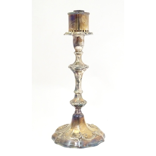 541 - A silver plate candlestick with acanthus scroll detail. Approx. 11 1/2