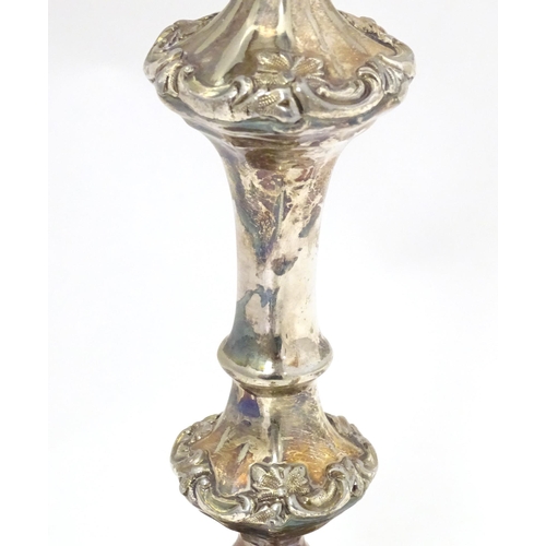 541 - A silver plate candlestick with acanthus scroll detail. Approx. 11 1/2