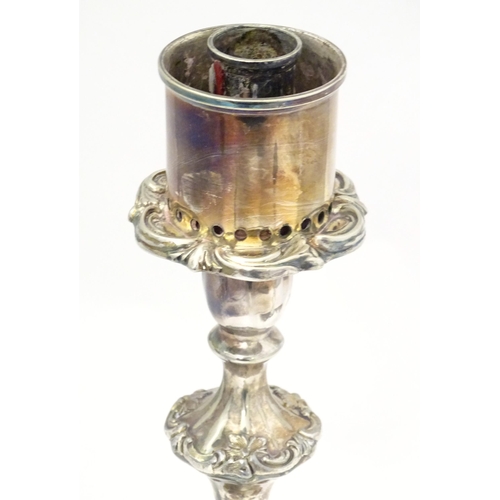 541 - A silver plate candlestick with acanthus scroll detail. Approx. 11 1/2