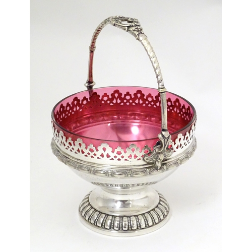 544 - A WMF silver plate sugar bowl with loop handle and cranberry glass liner. Approx. 6 1/2