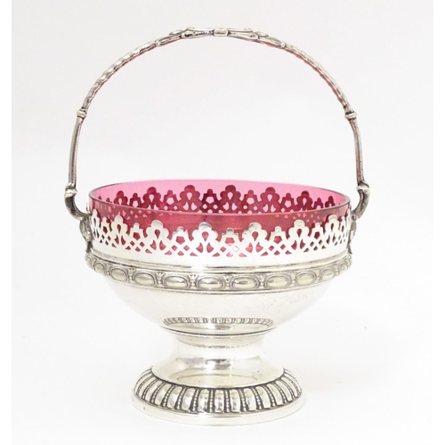 544 - A WMF silver plate sugar bowl with loop handle and cranberry glass liner. Approx. 6 1/2